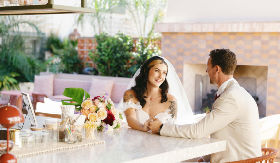 wedding couple sitting at the hotel bar