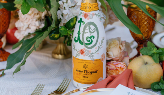 Champagne bottle at wedding table