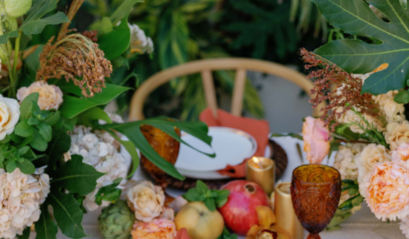table setting with flowers and fruit
