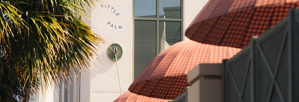 Closeup of umbrellas next to the pool area