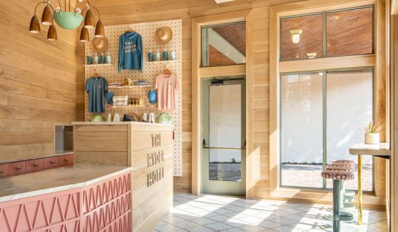 The Ryder Hotel apparel hung on the wall in the lobby area