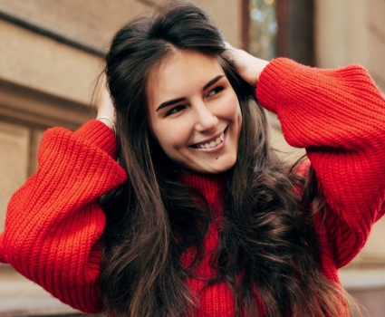 A woman in a red sweater