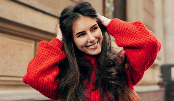 A woman in a red sweater