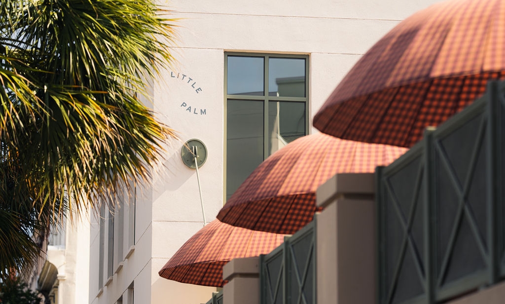 Sun umbrellas visible from the outside of Little Palm at Ryder Hotel