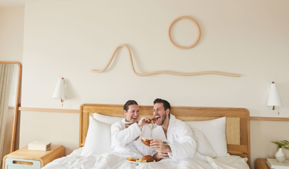 Couple having breakfast in bed