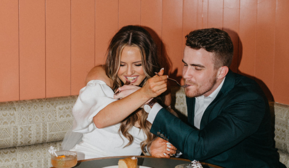 The bride and groom eating