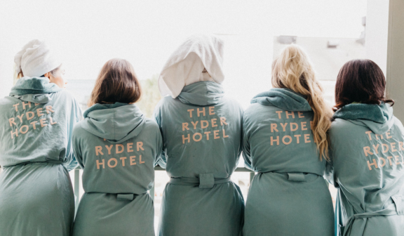Friends in matching bathrobes