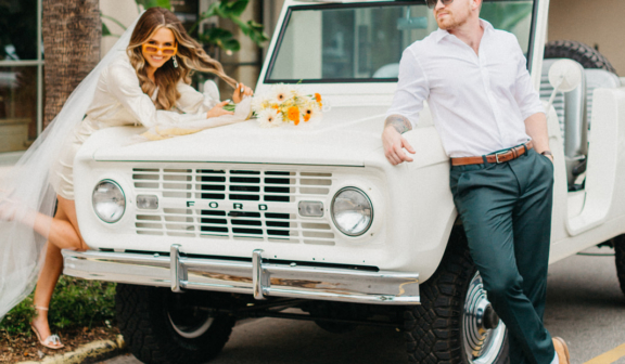 The bride and groom outside of hotel