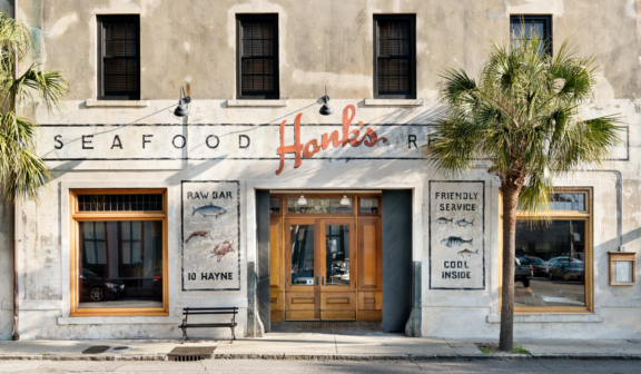 exterior of Hanks Seafood Restaurant building with painted sign