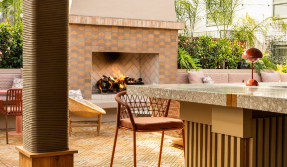 outdoor bar space with outdoor fireplace