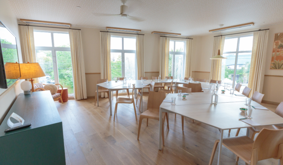 Meeting room with wood flooring and modern seating