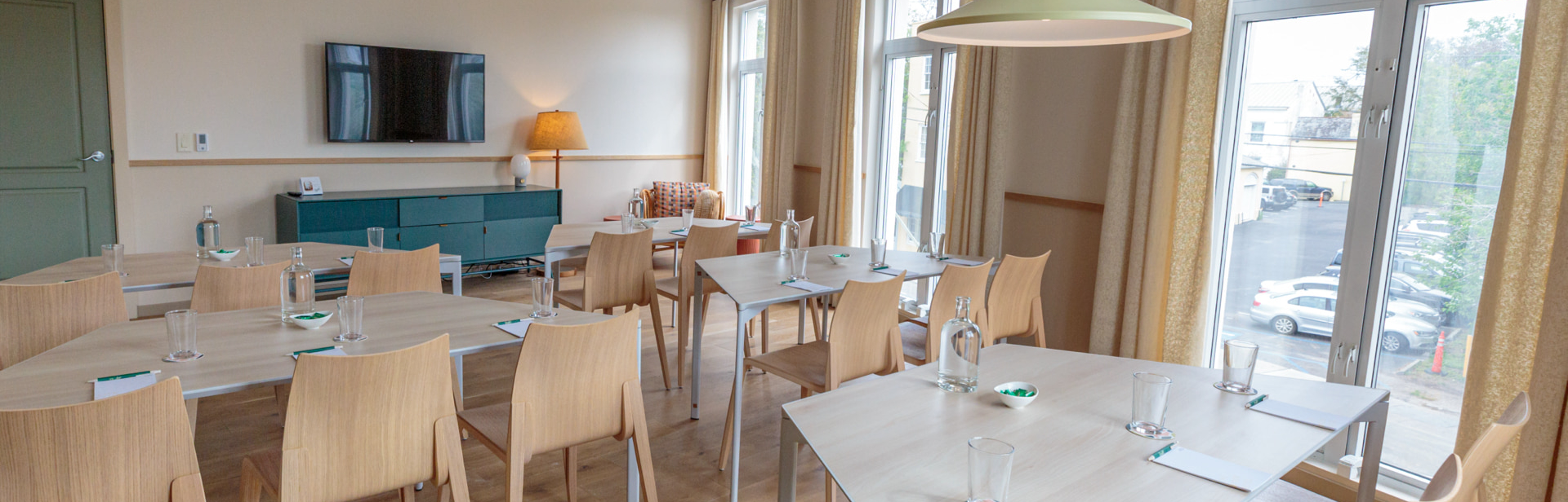 Meeting room with wood flooring and modern seating