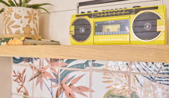 yellow boombox sitting on shelf