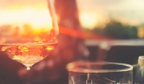 beverage glasses with sunset