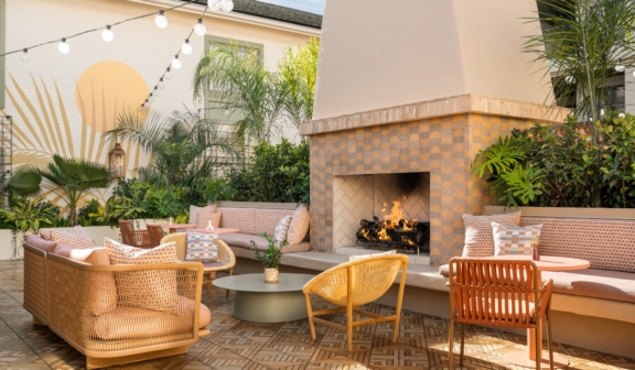 outdoor sitting area in front of a fireplace