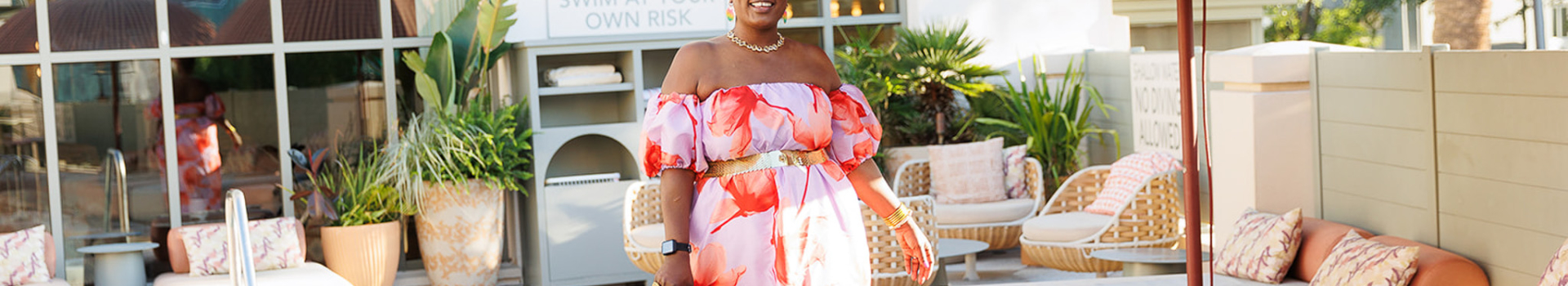 women walking by pool in pink dress with green heels