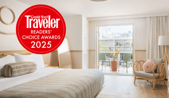 Conde Nast Traveler logo on king bed